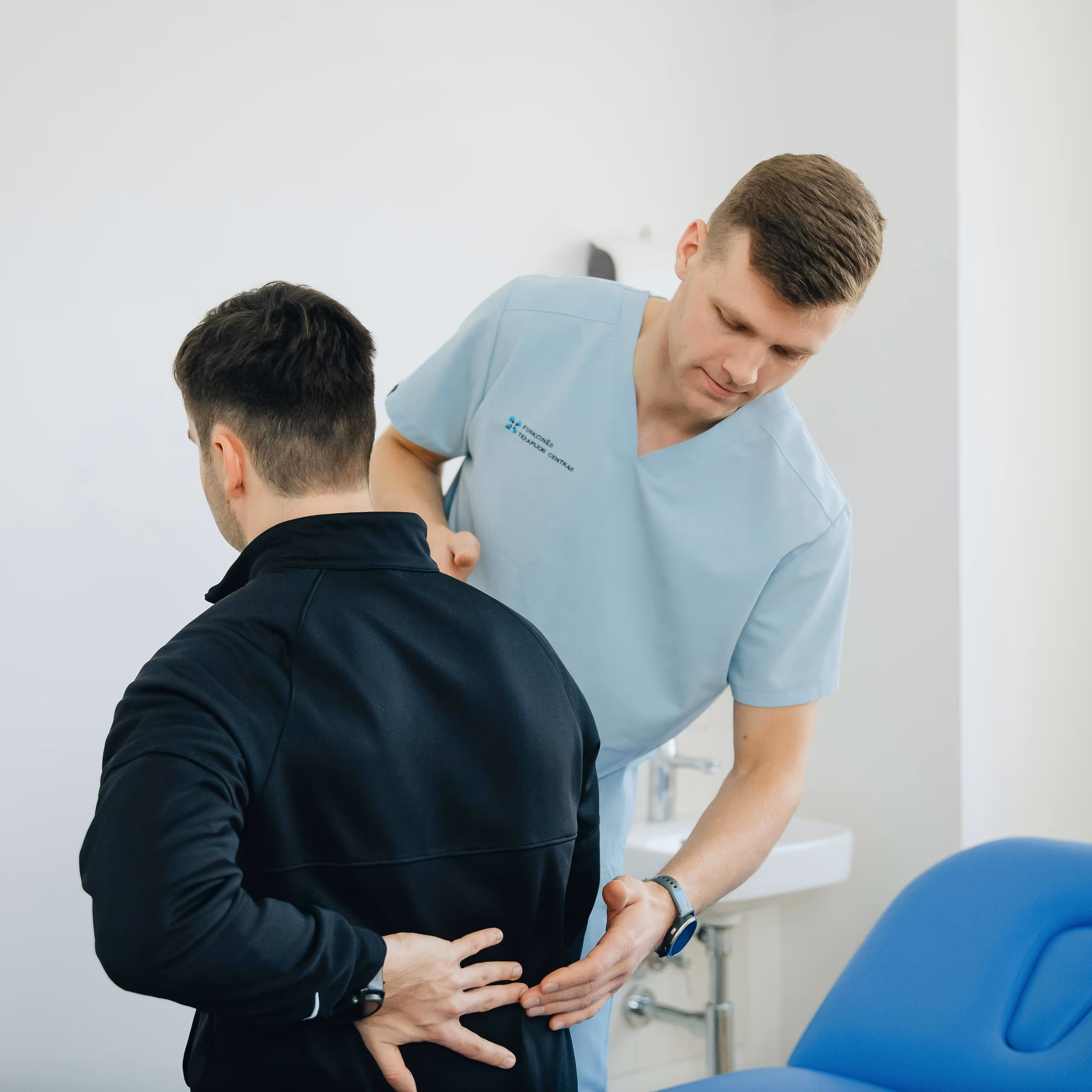 Clinician advising a patient on managing medication side-effects